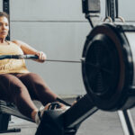 a woman on a rowing machine in a weight loss tool